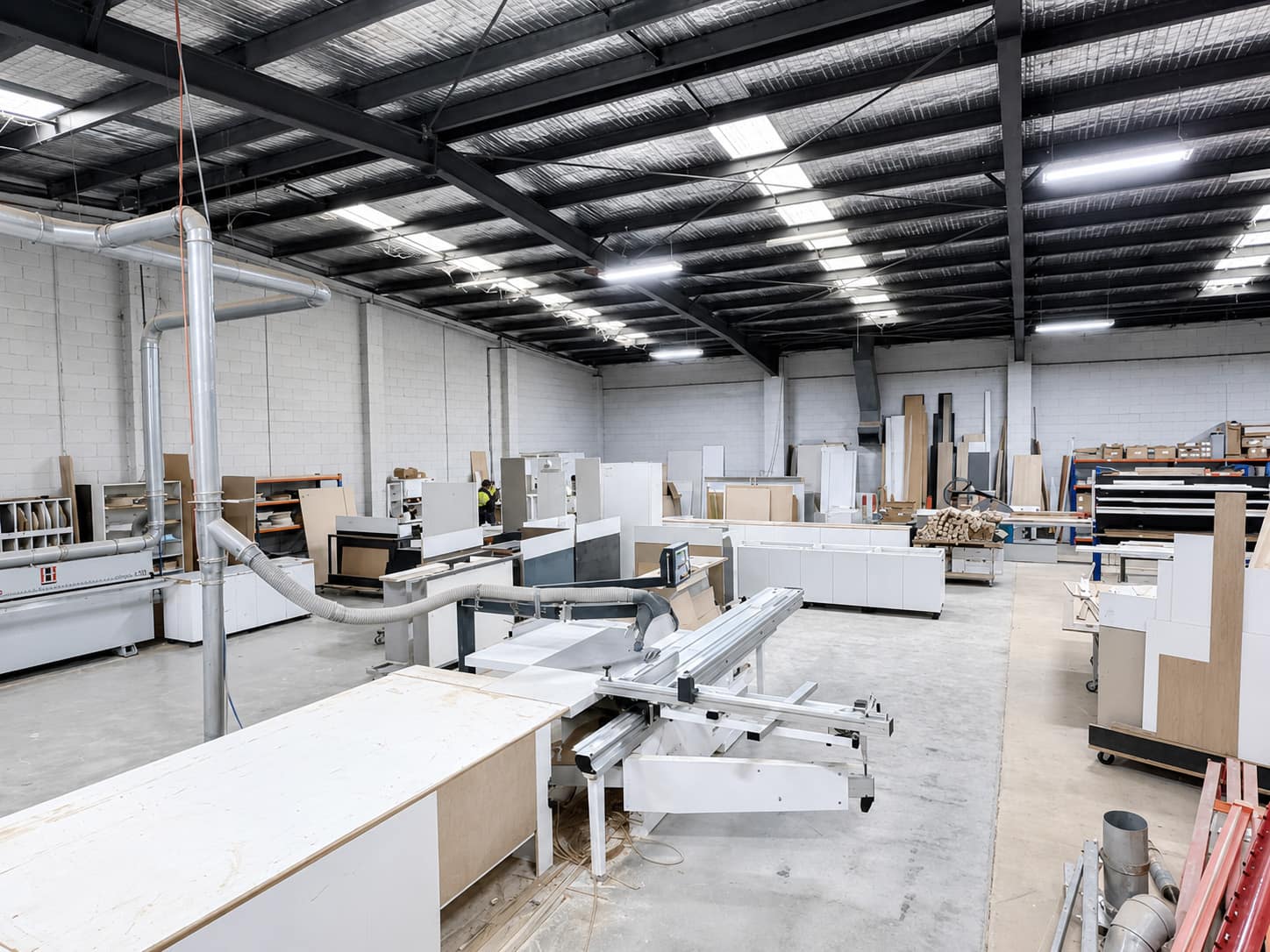 The Vanify workshop floor in Melbourne — panel saws, cabinetry and finished carcasses